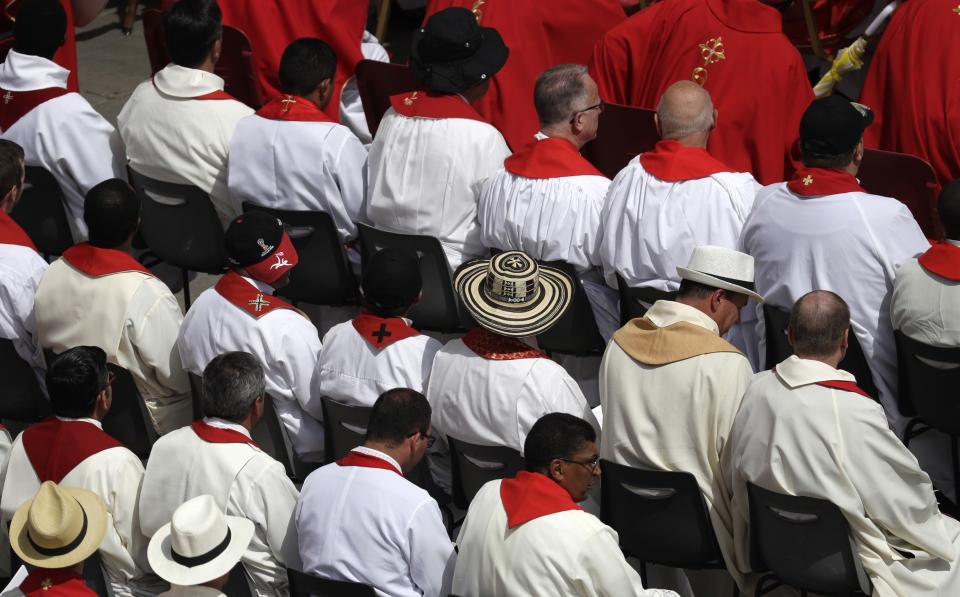 Prelates wear hats as they attend a Pentecost Mass celebrated by Pope Francis, in St. Peter's Square, at the Vatican, Sunday, June 9, 2019. The Pentecost Mass is celebrated on the seventh Sunday after Easter. (AP Photo/Gregorio Borgia)