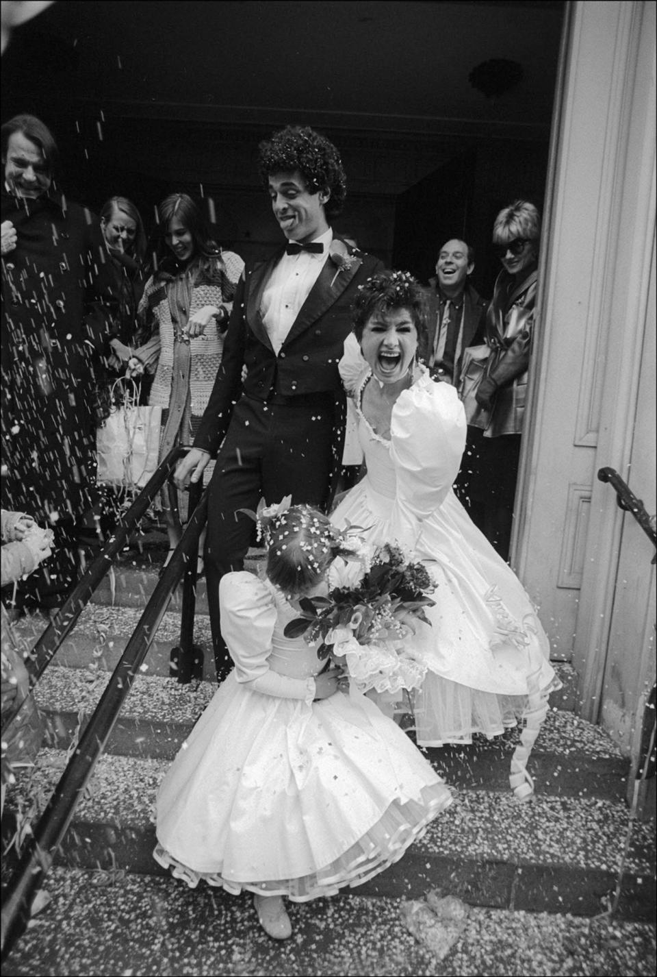 Jeffrey Oliviere and Betsy Johnson leave their wedding ceremony on February 7, 1981.
