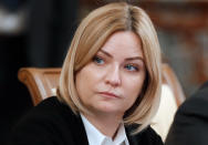 In this photo taken on Thursday, May 12, 2020, Russian Culture Minister Olga Lyubimova attends a new cabinet meeting in Moscow, Russia. Russia's minister of culture has tested positive for the new coronavirus, the third Russian Cabinet member infected. Culture Minister Olga Lyubimova has light symptoms and is undergoing treatment at home, according to her office. Lyubimova is the third member of the Russian Cabinet diagnosed with the virus.(Dmitry Astakhov, Sputnik, Kremlin Pool Photo via AP)
