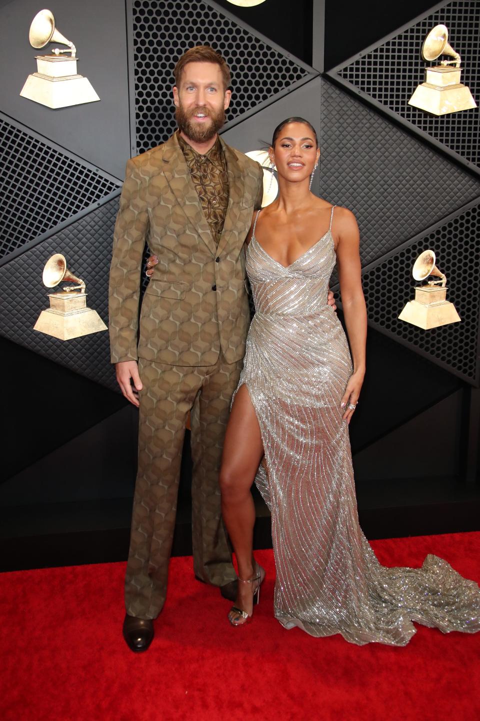 Calvin Harris and Vick Hope arrive at the 66th Annual Grammy Awards at Crypto.com Arena in Los Angeles on Feb. 4, 2024.