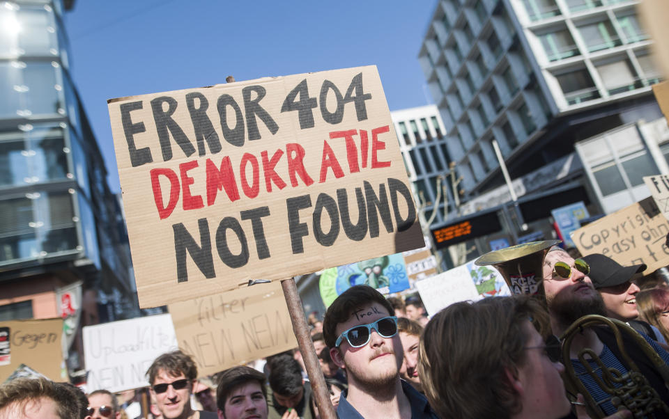 People protest against the Directive on Copyright in the Digital Single Market by the European Union in Stuttgart, Germany, Saturday, March 23, 2019. People fear for the freedom of the internet when users content has to pass upload filters to protect copyrights. (Sebastian Gollnow/dpa via AP)