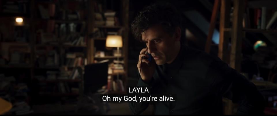 Marc on the phone, with a subtitle reading, "Layla: Oh my god, you're alive"