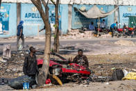 People watch as Secretary of State Antony Blinken's motorcade moves through Kinshasa, Congo, Tuesday, Aug. 9, 2022. Blinken is on a ten day trip to Cambodia, Philippines, South Africa, Congo, and Rwanda. (AP Photo/Andrew Harnik, Pool)