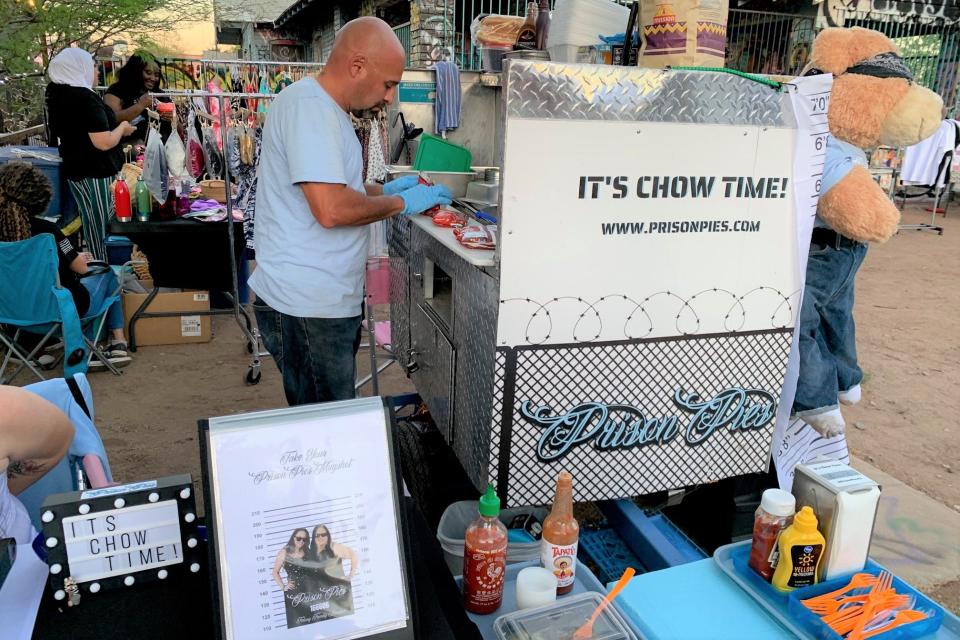 John Avila makes prison tamale at his stand.