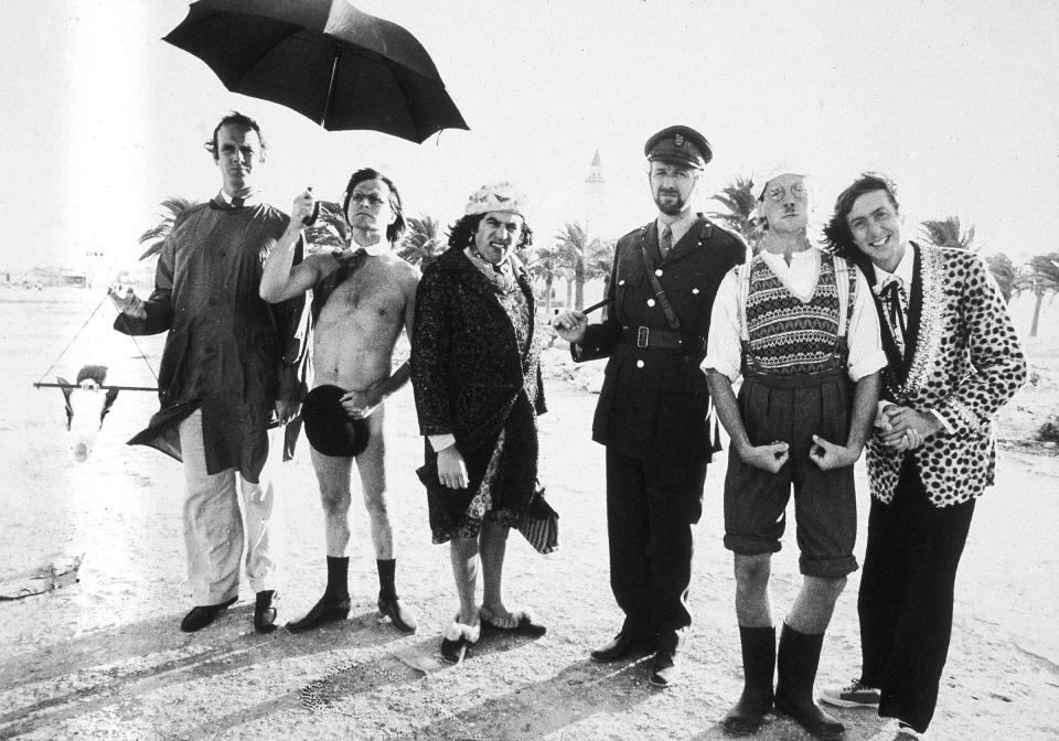 Idle (far right) with members of the Monty Python team on location in Tunisia to film <em>Monty Python's Life of Brian</em>, which features the song "Always Look on the Bright Side of Life," 1978.<span class="copyright">Evening Standard/Getty Images</span>