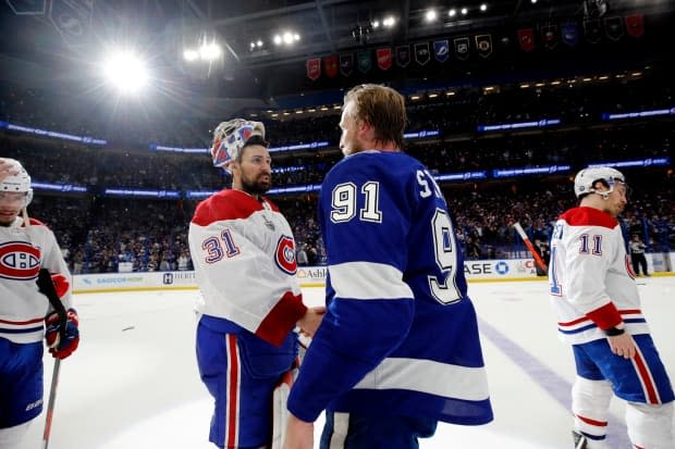 Carey Price, left, shakes hands with the Tampa Bay Lightning's Steven Stamkos after the Montreal Canadiens were defeated in the 2021 Stanley Cup final on Wednesday. (Bruce Bennett/Getty Images - image credit)