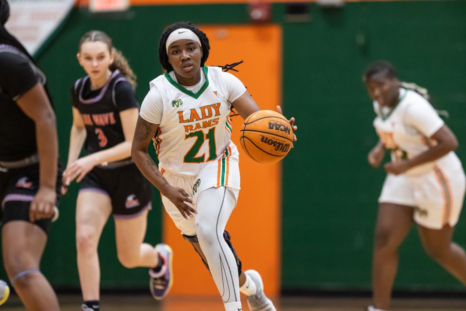 Eastside Rams guard Precious Marshall (21) dribbles the ball during the first half against the P.K. Yonge Blue Wave at Eastside High School in Gainesville, FL on Friday, January 5, 2024. [Matt Pendleton/Gainesville Sun]