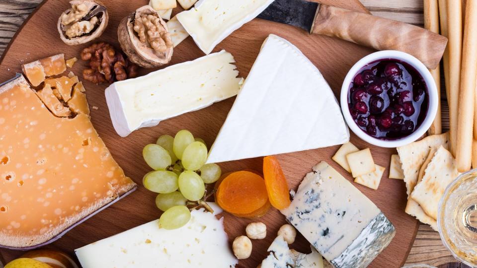 cheese platter with fruits and wine