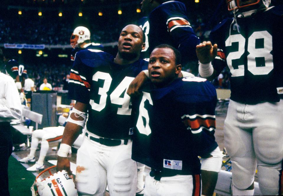 Jan 2, 1984; New Orleans, LA, USA; FILE PHOTO; Auburn Tigers running backs Bo Jackson (34) and Lionel James (6) on the sideline against the Michigan Wolverines during the 1984 Sugar Bowl at the Superdome. The Tigers defeated the Wolverines 9-7. Mandatory Credit: Manny Rubio-USA TODAY Sports 
