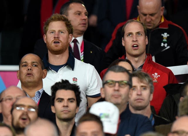 Harry and William singing the National Anthem