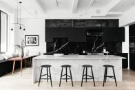 <p>In this <a href="https://www.elledecor.com/design-decorate/house-interiors/a21564374/jae-joo-lower-east-side-condo-tour/" rel="nofollow noopener" target="_blank" data-ylk="slk:Lower East Side condo;elm:context_link;itc:0;sec:content-canvas" class="link ">Lower East Side condo</a>, the dining area and kitchen connect and lead out to the balcony, so doing the cooking area in one finish would have overpowered the room. So, <a href="https://www.homepolish.com/designers/jaejoo" rel="nofollow noopener" target="_blank" data-ylk="slk:Homepolish designer Jae Joo;elm:context_link;itc:0;sec:content-canvas" class="link ">Homepolish designer Jae Joo</a> paired a black marble blacksplash with a white marble island. Black stools and black glossy cabinets with white throw pillows as accents break things up.</p>