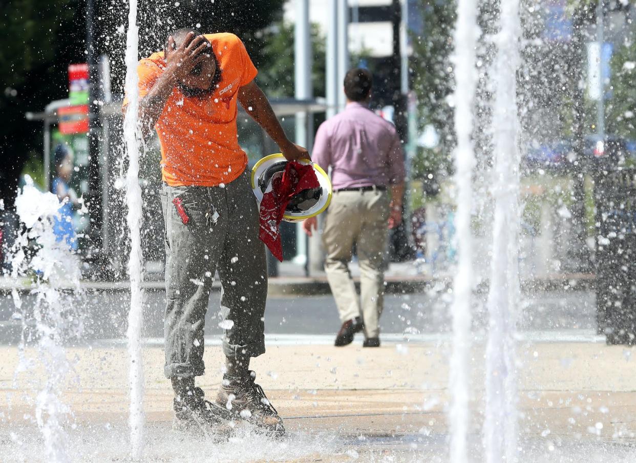 <span class="caption">Long-term exposure to high heat can become lethal.</span> <span class="attribution"><a class="link " href="https://www.gettyimages.com/detail/news-photo/construction-worker-stops-to-cool-off-in-the-water-news-photo/1162996602?adppopup=true" rel="nofollow noopener" target="_blank" data-ylk="slk:Mark Wilson/Getty Images;elm:context_link;itc:0;sec:content-canvas">Mark Wilson/Getty Images</a></span>