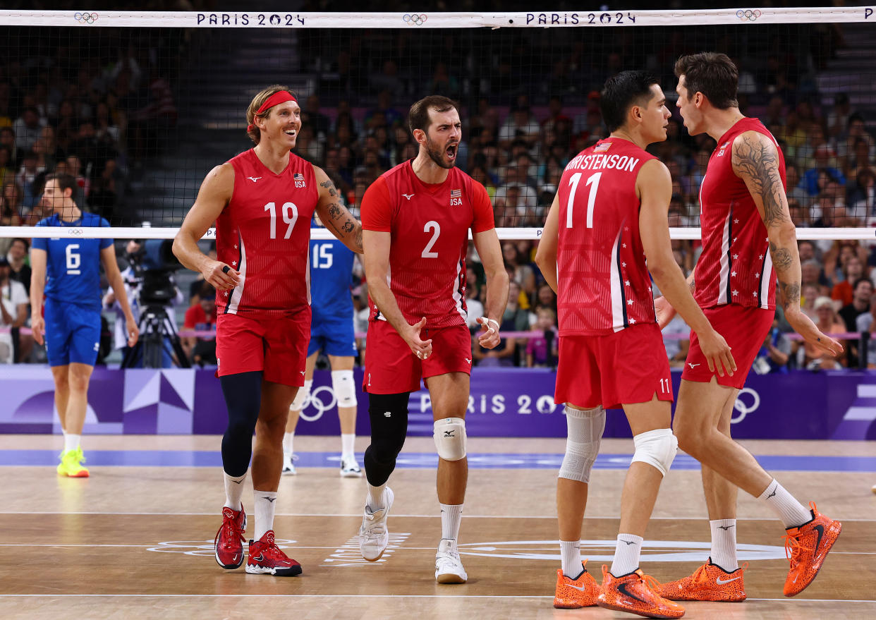 PARIS, FRANCE - AUGUST 09: Aaron Russell #2 of Team United States reacts with teammates during a Men's Bronze Medal Match between Team Italy and Team United States on day fourteen of the Olympic Games Paris 2024 at Paris Arena on August 09, 2024 in Paris, France. (Photo by Buda Mendes/Getty Images)