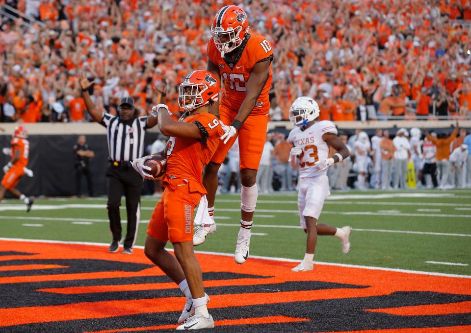 Oklahoma State wide receiver Bryson Green celebrates after scoring a touchdown in the fourth quarter against Texas.