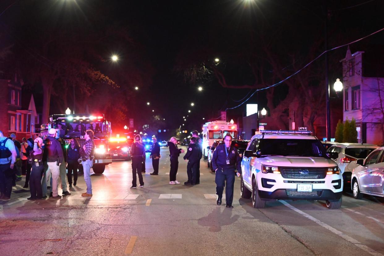 <span>Police respond to a shooting in Chicago, Illinois, on Saturday.</span><span>Photograph: Anadolu/Getty Images</span>