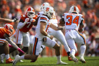 Syracuse quarterback Rex Culpepper (17) hands off to Syracuse running back Sean Tucker (34) during an NCAA college football game against Clemson in Clemson, S.C., on Saturday, Oct. 24, 2020. (Ken Ruinard/Pool Photo via AP)