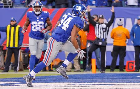 Dec 20, 2015; East Rutherford, NJ, USA; New York Giants running back Shane Vereen (34) scores touchdown during the fourth quarter against the Carolina Panthers at MetLife Stadium. Mandatory Credit: Jim O'Connor-USA TODAY Sports