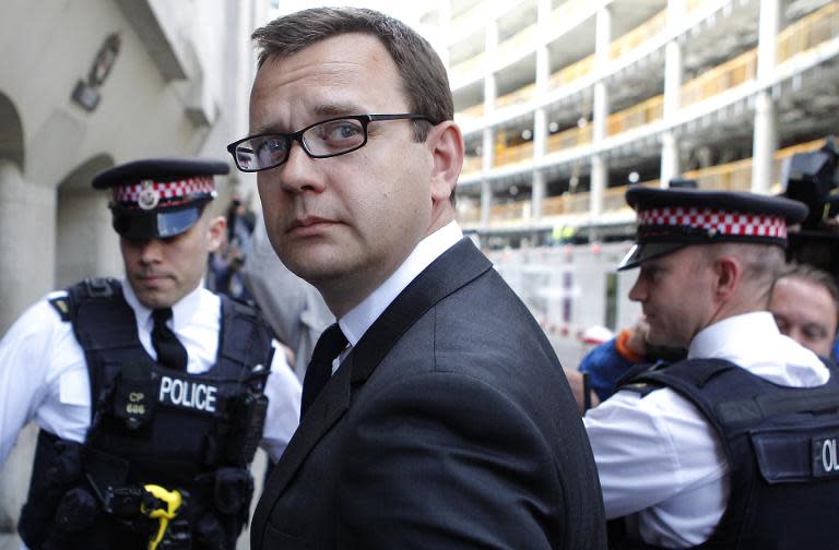 Picture taken on July 4, 2014, shows Andy Coulson, (2nd L) a former top aide to British Prime Minister David Cameron arriving at the Old Bailey in central London, ahead of his expected sentencing in a phone-hacking trial