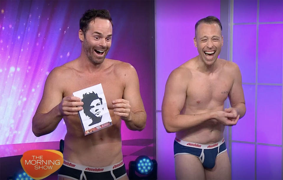 The Naked Magicians on The Morning Show holding up a cut-out picture of Harry Styles