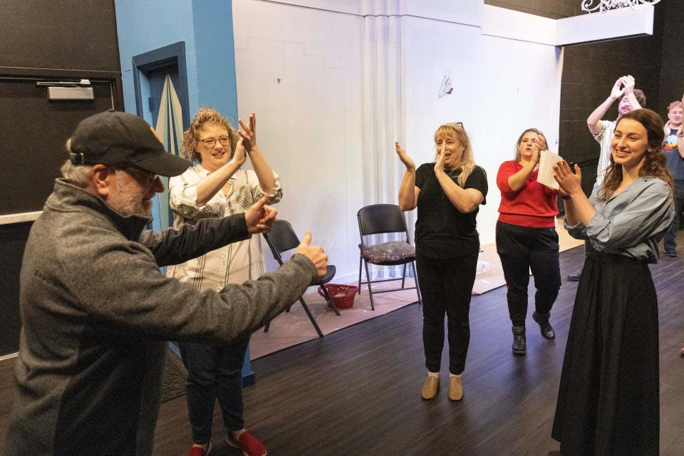Lawrence Hultberg is congratulated by the Oklahoma Shakespeare in the Park cast after joining in the rehearsal for the immersive holiday show "Jane Austen's Christmas Cracker" on Friday, November 2, 2022 in Oklahoma City.
