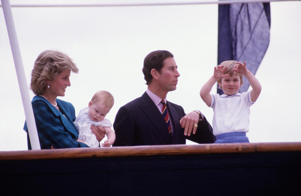 Diana Princess of Wales and Charles Prince of Wales hold Prince Harry and Prince William on the deck of the Royal Yacht Britannia, during the Royal Tour of Italy on May 5, 1985 in Venice Italy.