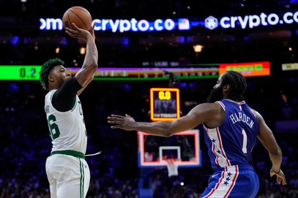 Boston Celtics' Marcus Smart goes up to shoot against Philadelphia 76ers' James Harden during overtime of Game 4 in an NBA basketball Eastern Conference semifinals playoff series, Sunday, May 7, 2023, in Philadelphia. (AP Photo/Matt Slocum)