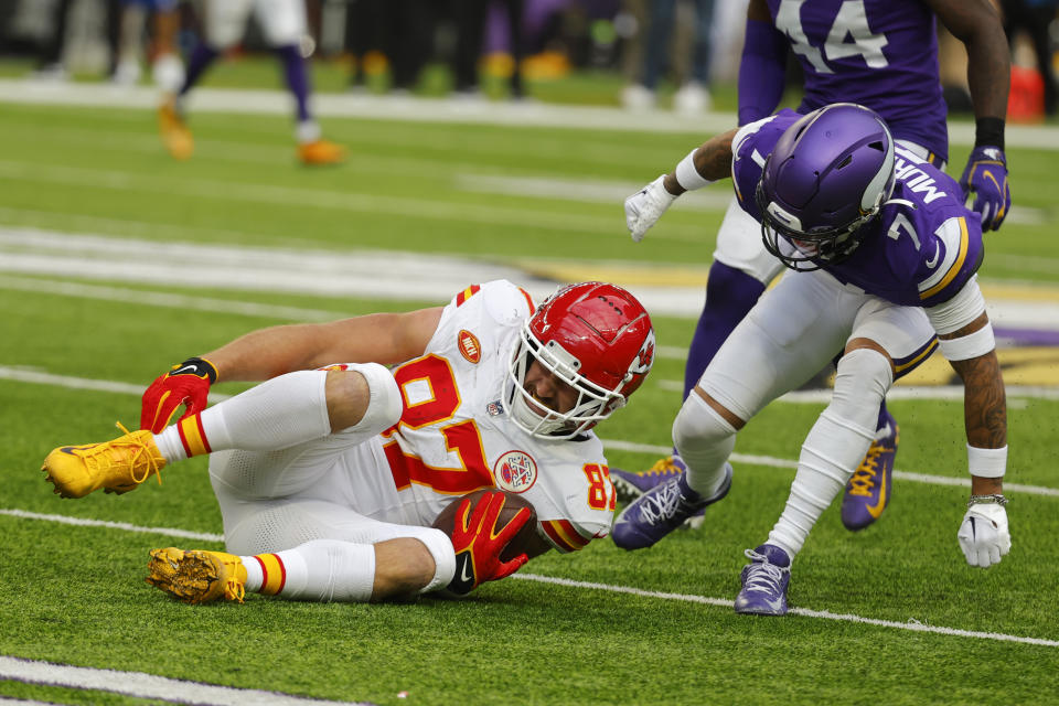 Kansas City Chiefs tight end Travis Kelce (87) reacts in front of Minnesota Vikings cornerback Byron Murphy Jr. (7) after getting injured during the first half of an NFL football game, Sunday, Oct. 8, 2023, in Minneapolis. (AP Photo/Bruce Kluckhohn)