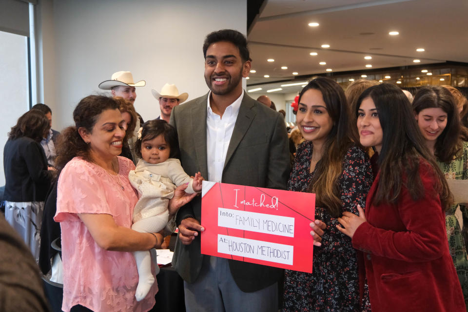 A Texas Tech University Health Sciences Center School of Medicine graduate celebrates with his family at Match Day Friday at Hodgetown in Amarillo.