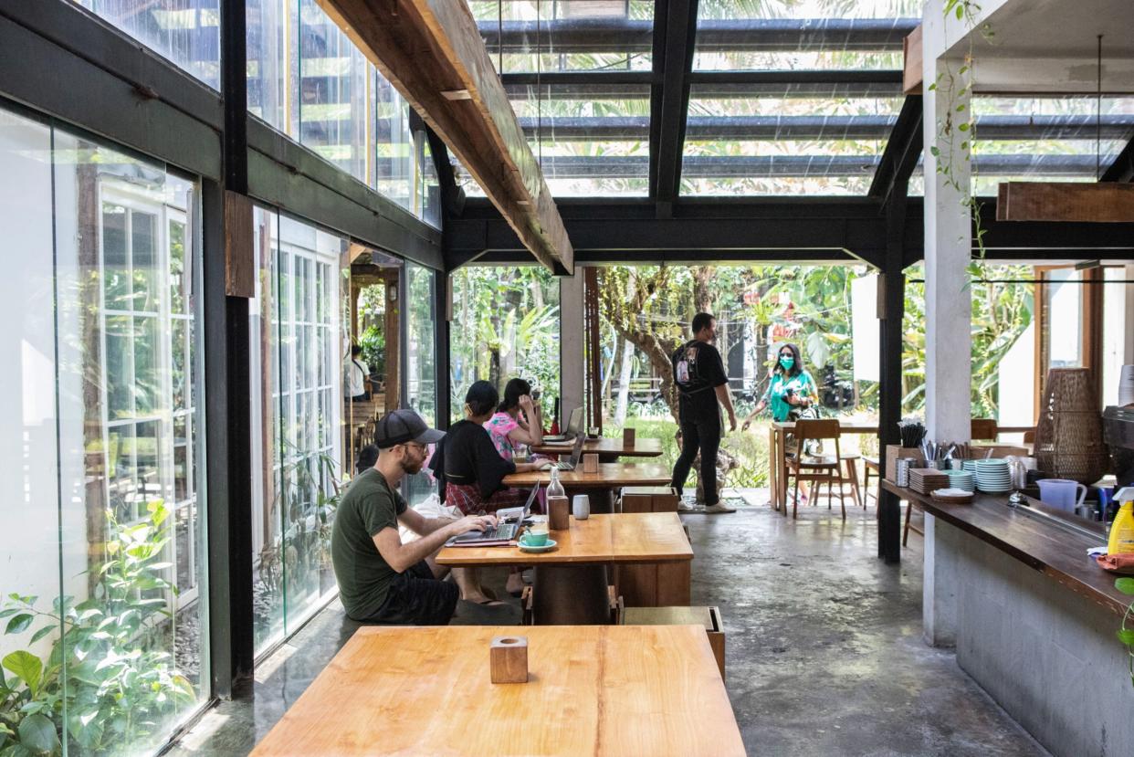 Customers with laptops at a cafe in Bali's Seminyak area. (PHOTO: Putu Sayoga/Bloomberg)