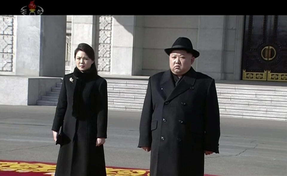 In this image made from video released by KRT on Feb. 8, 2018, North Korean leader Kim Jong Un, right, and his wife Ri Sol Ju arrive at a military parade in Pyongyang, Thursday, Feb. 8 2018. (KRT via AP)