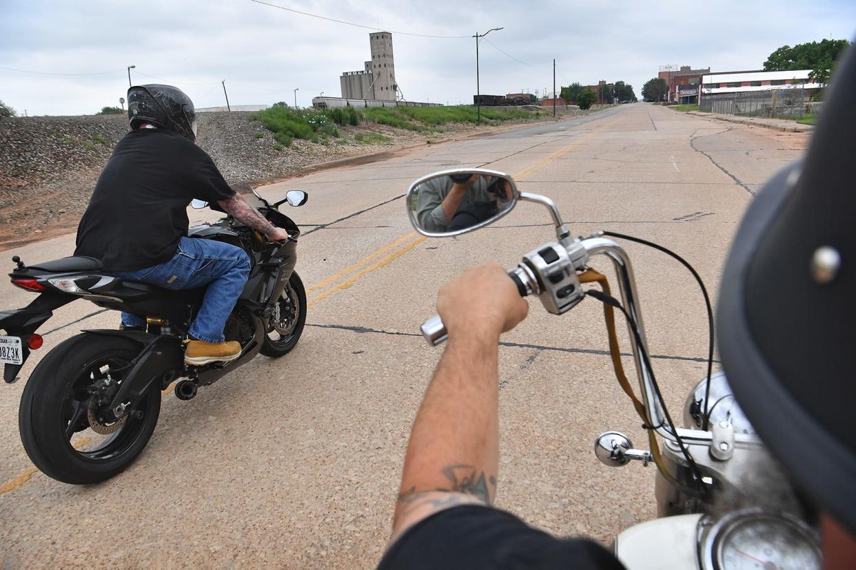 Roy Tyler, left, and Josh Root of G&S Suzuki, enjoy the warm weather as they ride around downtown Wichita Falls. May is National Motorcycle Safety Awareness Month.
