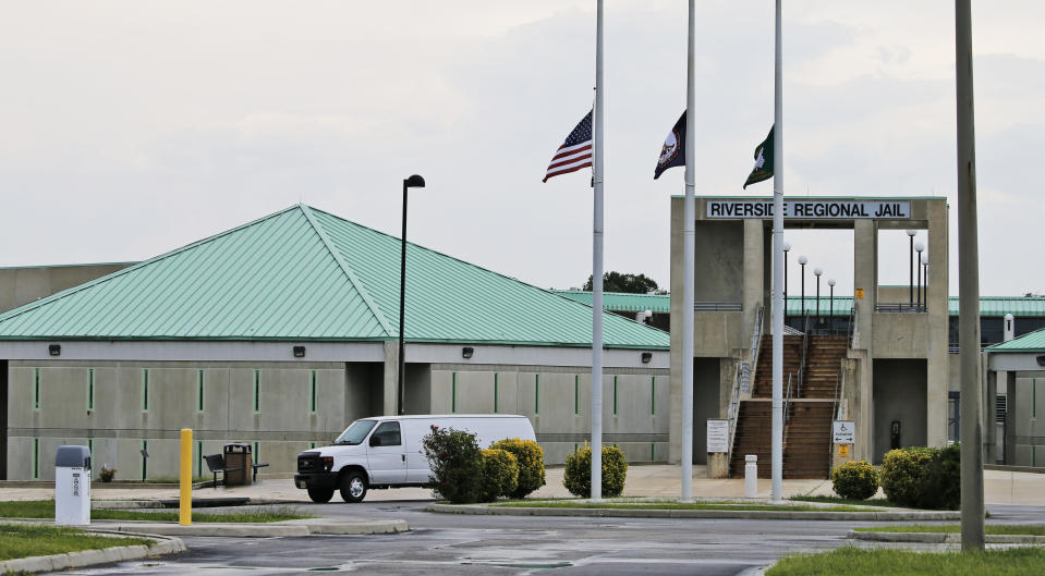 This Wednesday Aug. 7 2018 photo shows the entrance to the Riverside Regional Jail in Prince George, Va. The jail was the site of a suicide by inmate Alex Wesley Tripp who died shortly after his arrival at the jail. (AP Photo/Steve Helber)