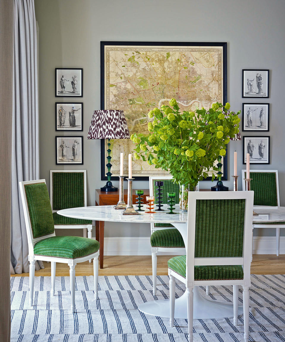 <p> When not in use, dining tables make for the most wonderful display surfaces. With a little effort they can be transformed into a mini exhibition space for gathered collectibles, which can then be whisked away when the table is called into action for entertaining.  </p> <p> Ben Pentreath demonstrates how to best dress a ‘resting’ table in this scheme that he designed for a flat in Chelsea, London. The bottle green French velvet that covers the white gesso framed Louis XVI chairs is picked up by the collection of glass candlesticks and resin lamp bases on the table and the dresser behind. Also important to this room is the display of artwork on the walls; the symmetrical arrangement brings order and structure. </p>