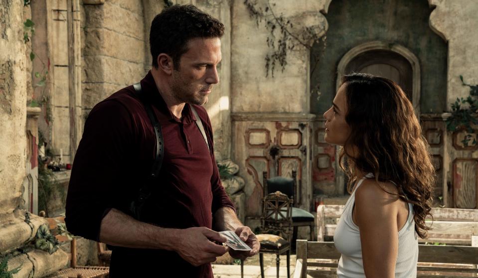 Ben Affleck stars as an Austin cop who reaches out to a fortune teller (Alice Braga) to help find his missing daughter in the sci-fi action movie "Hypnotic."