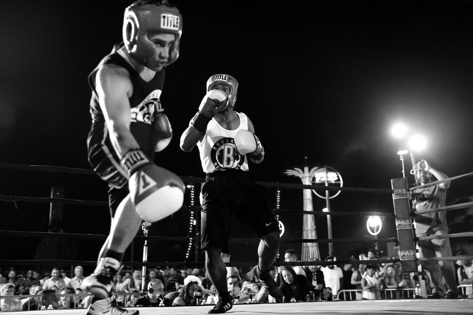 <p>Savvas Tjortjoglou stumbles backwards after being hit by Rashawn Merrick at the Brooklyn Smoker in Coney Island, Brooklyn, on Aug. 24, 2017. (Photo: Gordon Donovan/Yahoo News) </p>