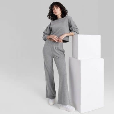 Model wearing sweatpants in heather grey