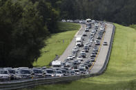 <p>A car rides in the shoulder to pass other cars in evacuation traffic on I-75 N, near Brooksville, Fla., in advance of Hurricane Irma, Saturday, Sept. 9, 2017. (Photo: Gerald Herbert/AP) </p>