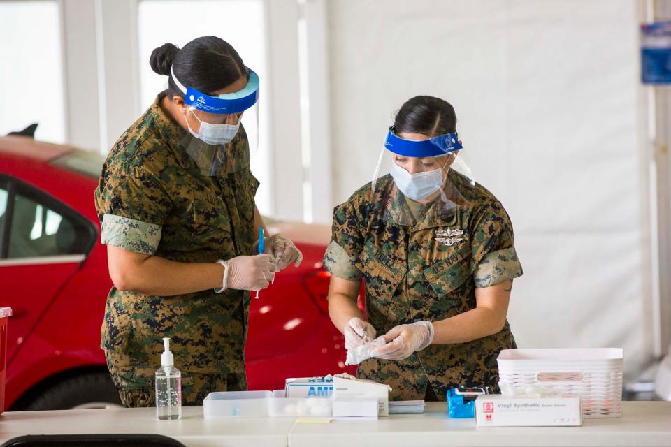 National Guard members staff a vaccination clinic near the Pipkin building in Memphis, Tenn., on April 7.