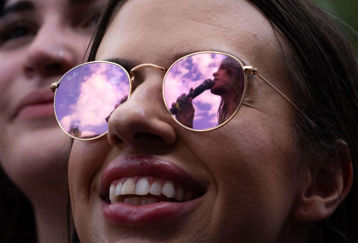 A fan watches as Ethel Cain performs Oct. 13 at the Austin City Limits Music Festival. Cain was on the lineup only for Weekend Two, and Statesman photographer Sara Diggins captured this image from the photo pit during her set. It's one of Diggins' favorites from both weekends.