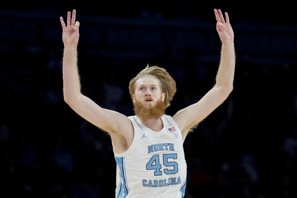 North Carolina's Brady Manek (45) celebrates after scoring three points in the first half of an NCAA college basketball game against Virginia during quarterfinals of the Atlantic Coast Conference men's tournament, Thursday, March 10, 2022, in New York. (AP Photo/John Minchillo)