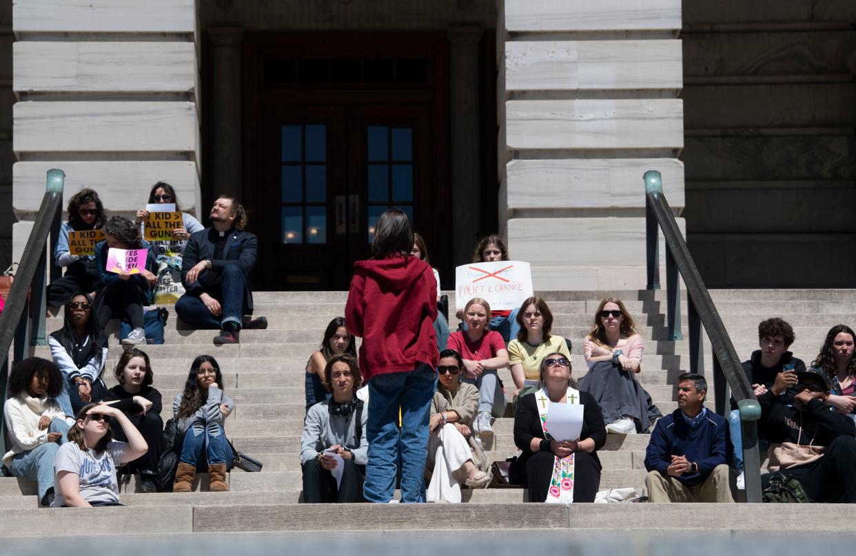 A group of students and other activists sit together at the Tennessee Capitol to protest HB1202, in Nashville, Tenn., Monday, April 22, 2024.