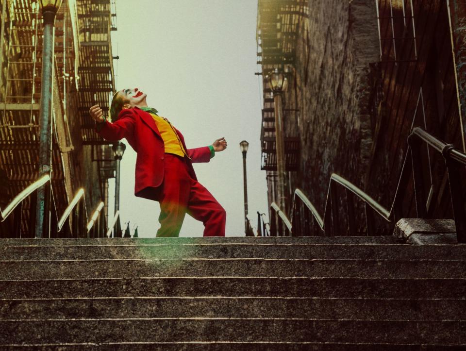 Joaquin Phoenix at the top of a set of stairs in "Joker."