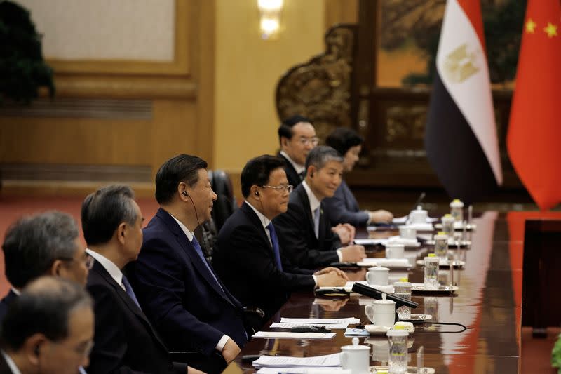 Chinese President Xi Jinping and Egyptian President Abdel Fattah al-Sisi attend a meeting in Beijing