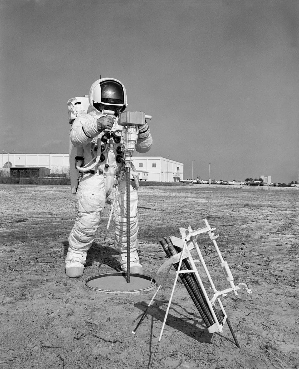 <p> During an extravehicular activity walkthrough on Jan. 28, 1970, astronaut Fred Haise, Apollo 13 lunar module pilot, uses an Apollo Lunar Surface Drill to make a 10-foot (3 meters) hole for a heat flow probe. On the lunar surface, an electronic instrument will measure the outward flux of heat from the hole. </p>