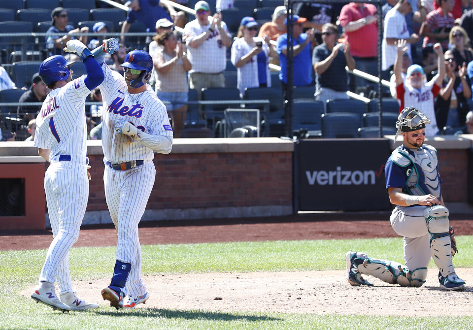 New York Mets' Pete Alonso (20) Jeff McNeil (1) celebrate after hitting a home run against the Seattle Mariners during the third inning of a baseball game, Sunday, Sept. 3, 2023 in New York. (AP Photo/Noah K. Murray)