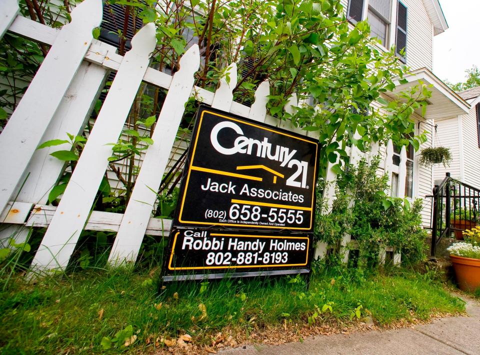 A home for sale stand in front of a house on Myrtle Street in Burlington in 2011.