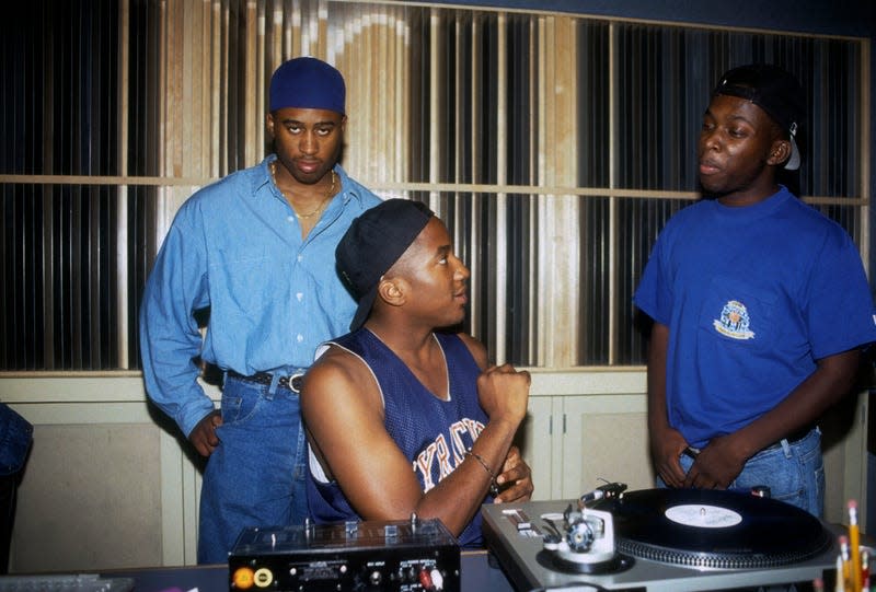 NEW YORK, NEW YORK—SEPTEMBER 01: Ali Shaheed Muhammad, Phife Dawg (aka Malik Izaak Taylor) and Q-Tip (aka Kamaal Ibn John Fareed) of the hip hop group “A Tribe Called Quest” work in the recording studio on September 10, 1991 in New York.