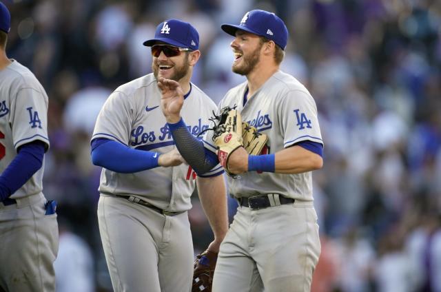 Freddie Freeman consoles José Iglesias during Dodgers-Rockies game