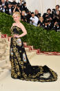 <p>Game of Thrones star Emilia Clarke ruled the night in this gold and black embellished Dolce and Gabanna gown. Photo: Getty Images </p>