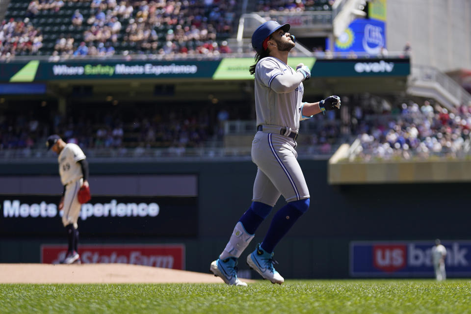 Toronto Blue Jays' Bo Bichette runs the bases after hitting a solo home run against the Minnesota Twins during the first inning of a baseball game Saturday, May 27, 2023, in Minneapolis. (AP Photo/Abbie Parr)